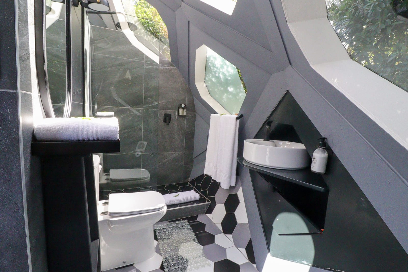 Bathroom inside the dome with hexagonal floor tiles